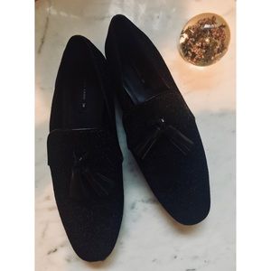 Zara black glitter flats with tassels.
